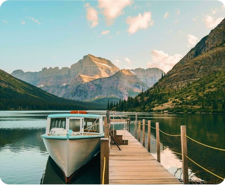 Boat on a clear mountain lake